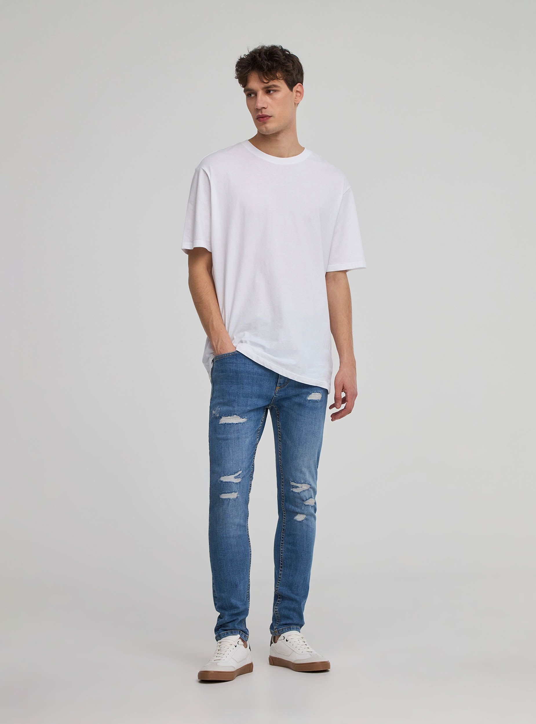 Jeans skinny con strappi Blu denim medio