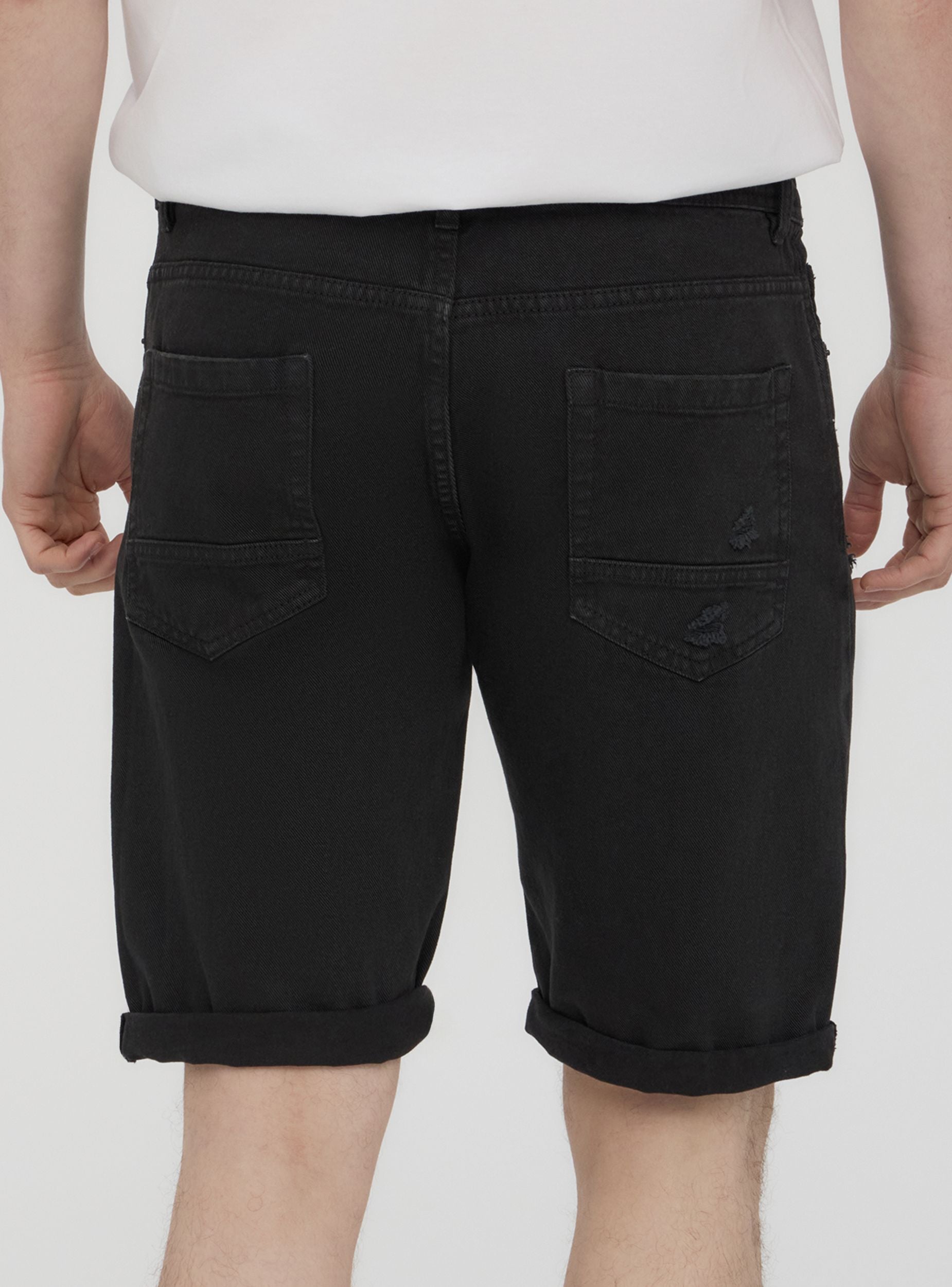 Bermuda in denim con strappi