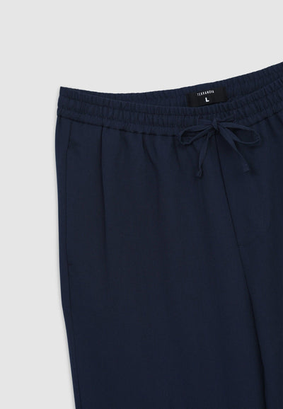 Pantaloni con elastico in vita e coulisse tinta unita