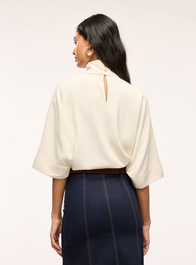 Blusa con collo alto e maniche 3/4