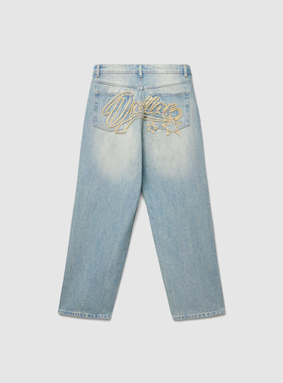Jeans super baggy con patch e borchie