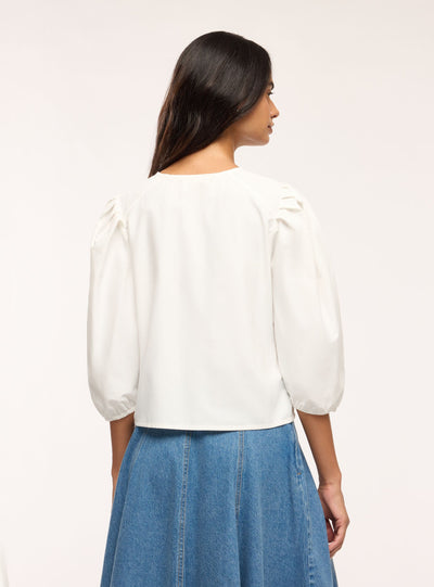Blusa con bottoni gioiello e maniche a sbuffo