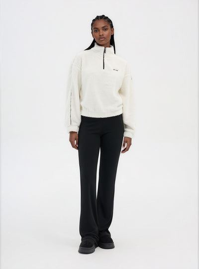 Felpa in sherpa con mezza zip e scritta