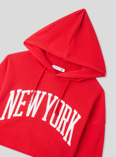 Felpa crop con cappuccio e stampa New York