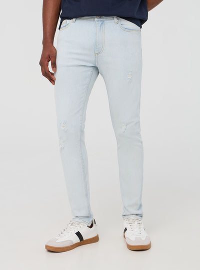 Light skinny jeans with rips