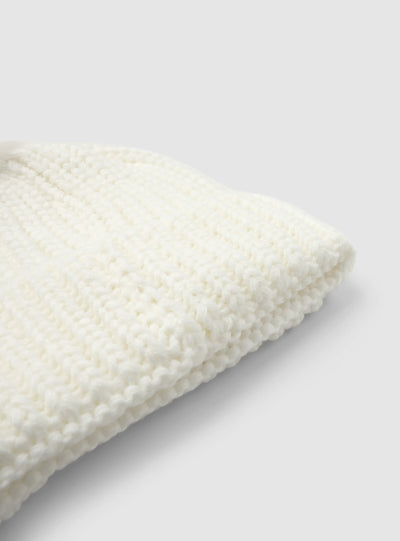 Cappellino beanie con pon pon a tinta unita