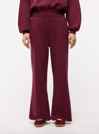 Pantaloni tuta wide leg con bande laterali