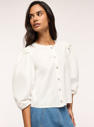 Blusa con bottoni gioiello e maniche a sbuffo
