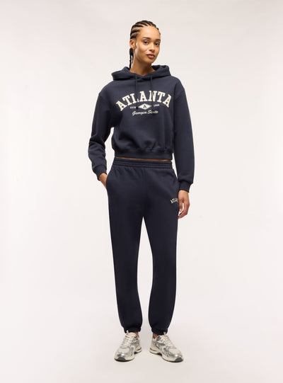 Pantaloni tuta vita alta con scritta college