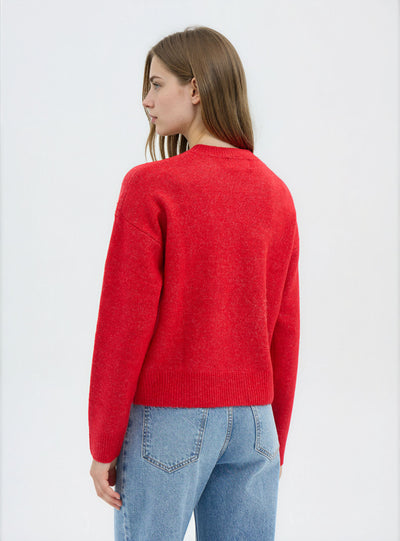 Pull large avec inscription de Noël et patch