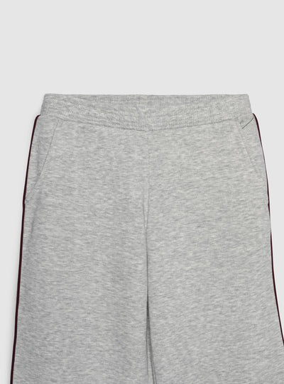 Pantaloni tuta wide leg con piping laterale