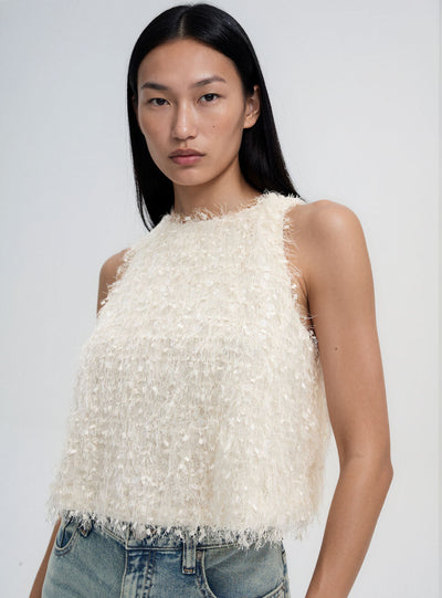 Top con paillettes e effetto piumette