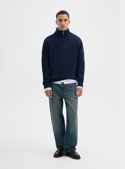 Maglia con collo alto e mezza zip