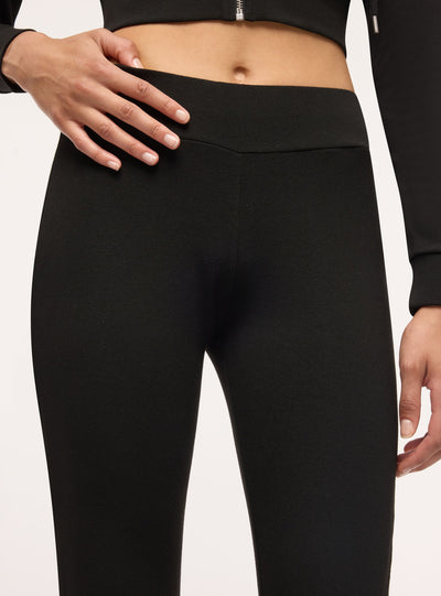 Leggings lunghi a zampa tinta unita