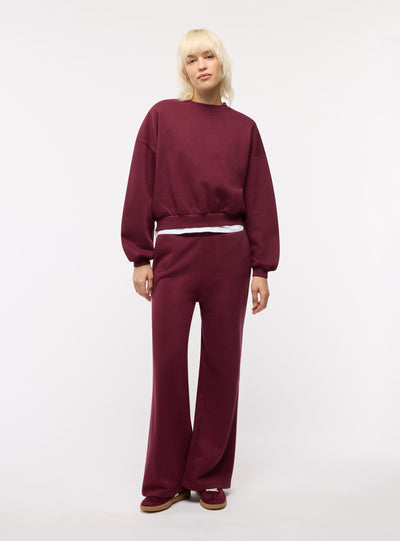 Pantaloni tuta wide leg con bande laterali