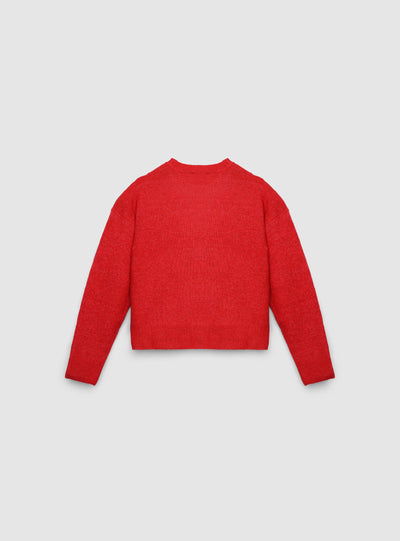 Pull large avec inscription de Noël et patch