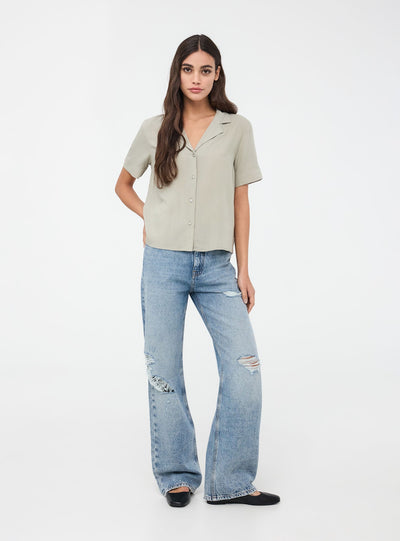 Jeans wide leg con strappi acid wash
