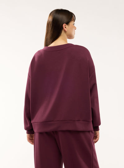 Felpa oversize con scollo a v
