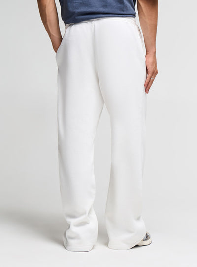 Pantaloni tuta wide leg con patch ricamata