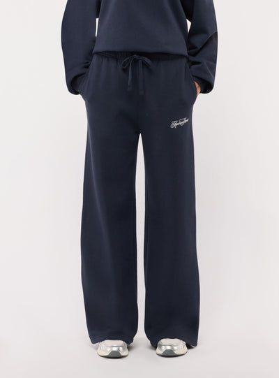 Pantaloni tuta wide leg con ricamo college