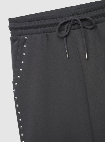 Pantaloni tuta wide leg con borchie