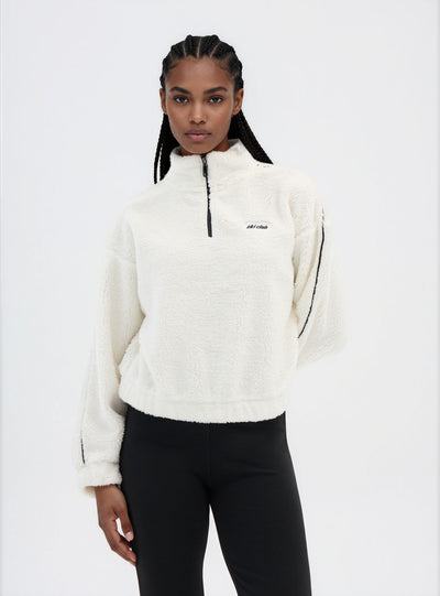 Felpa in sherpa con mezza zip e scritta
