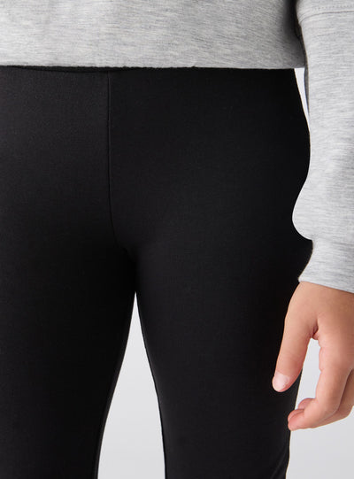 Leggings lunghi a zampa tinta unita