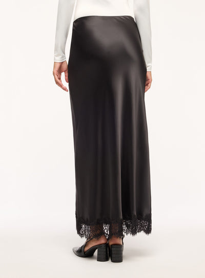 Gonna lunga svasata in satin con bordo in pizzo