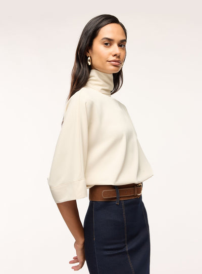 Blusa con collo alto e maniche 3/4