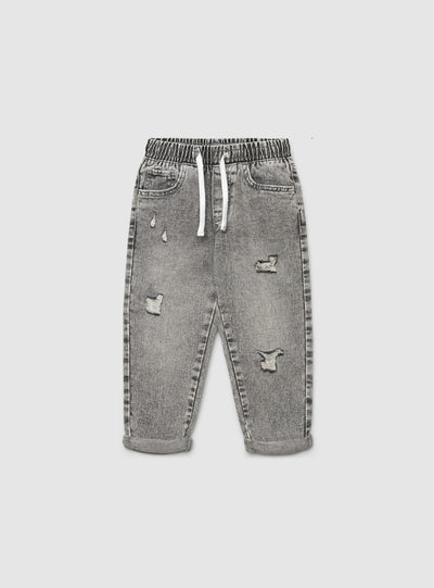 Jeans jogger da bambino con strappi e coulisse