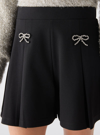 Shorts con fiocchi strass