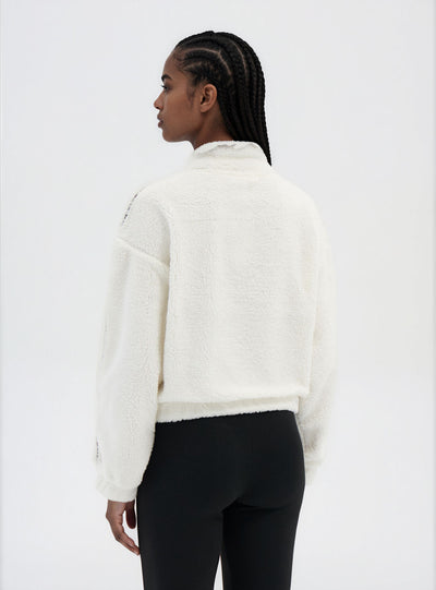 Felpa in sherpa con mezza zip e scritta