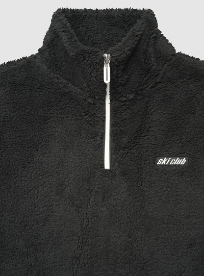 Felpa in sherpa con mezza zip e scritta