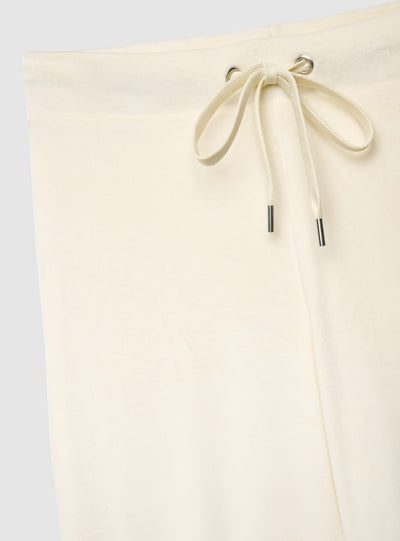 Pantaloni tuta a zampa ciniglia tinta unita