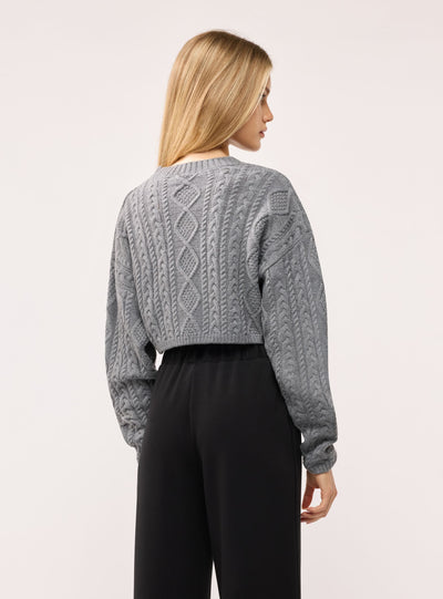 Maglia crop ampia a trecce