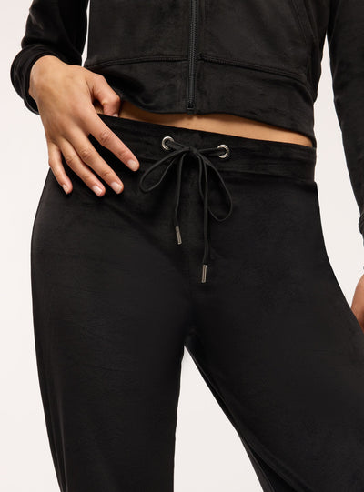 Pantaloni tuta a zampa ciniglia tinta unita