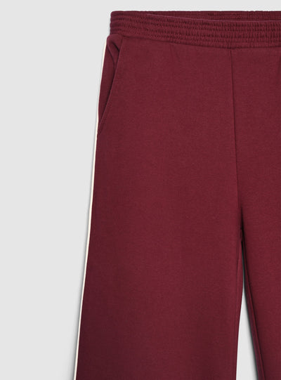Pantaloni tuta wide leg con bande laterali
