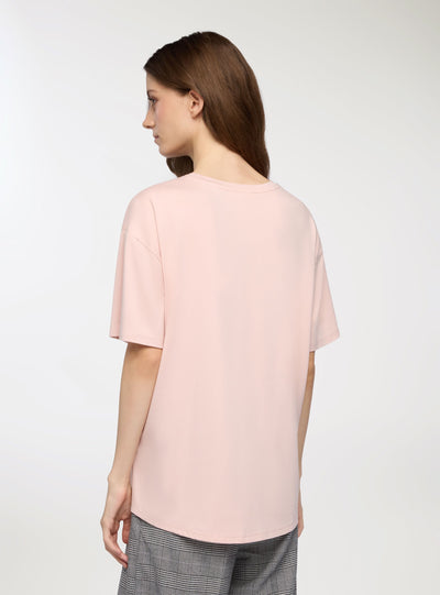 T-shirt con stampa volto e farfalle