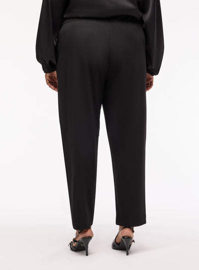 Pantaloni chinos cigarette a tinta unita