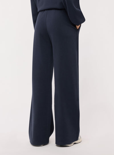 Pantaloni tuta wide leg con ricamo college