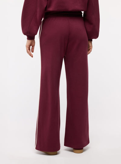Pantaloni tuta wide leg con bande laterali