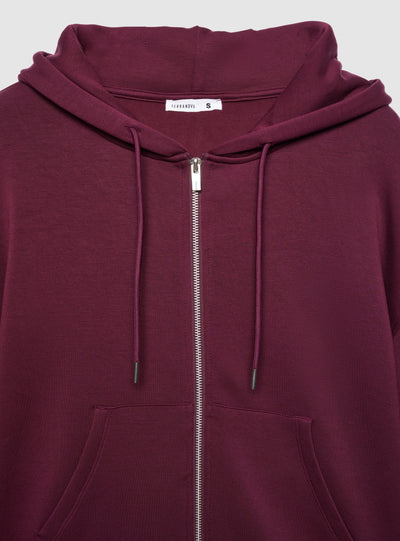 Felpa over con zip e cappuccio a tinta unita
