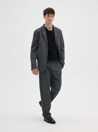 Pantaloni chino con pieghe a pied de poule