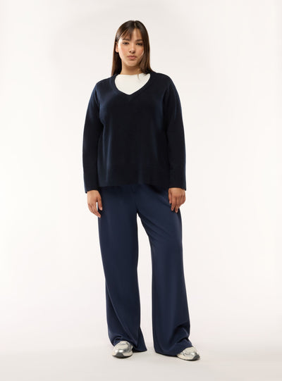 Maglia con scollo a V e bottoni laterali