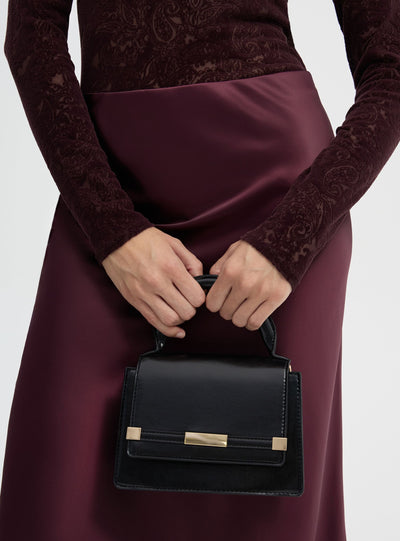 Borsa mini tinta unita con manico e tracolla regolabile