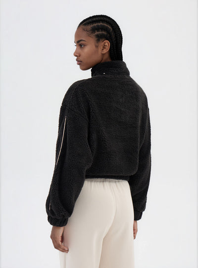 Felpa in sherpa con mezza zip e scritta