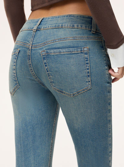 Jeans bootcut a vita bassa tinta unita