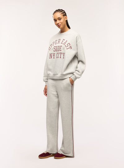 Pantaloni tuta wide leg con piping laterale
