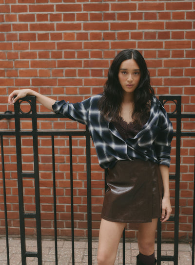 Asymmetric mini skort in faux leather
