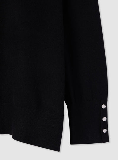 Plain-colour jumper with buttons at the cuffs